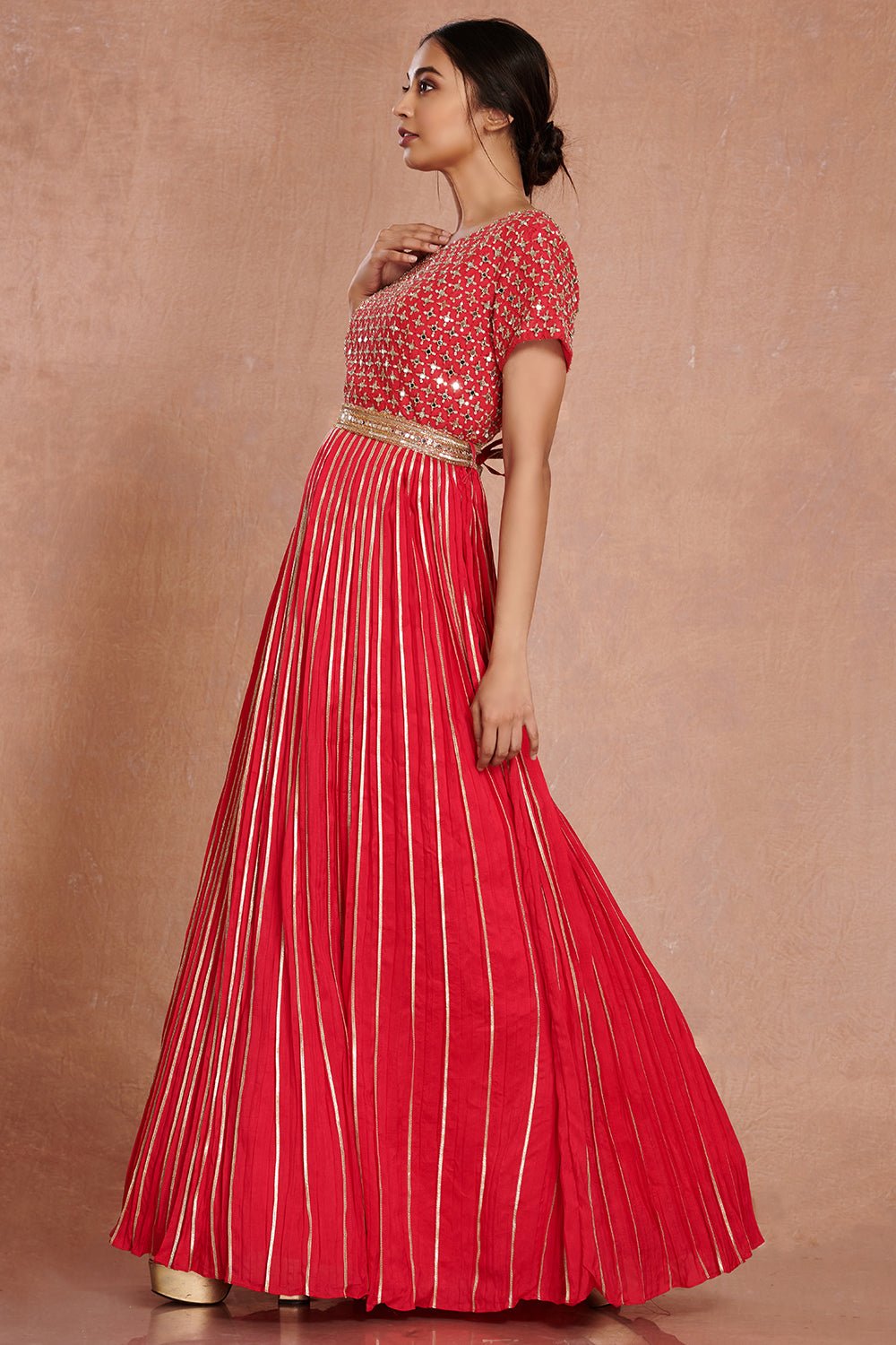 Shop stunning red fit and flare mirror work gown online in USA. Make a fashion statement on festive occasions and weddings with designer suits, Indian dresses, Anarkali suits, palazzo suits, designer gowns, sharara suits from Pure Elegance Indian fashion store in USA.-left