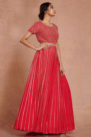 Shop stunning red fit and flare mirror work gown online in USA. Make a fashion statement on festive occasions and weddings with designer suits, Indian dresses, Anarkali suits, palazzo suits, designer gowns, sharara suits from Pure Elegance Indian fashion store in USA.-right