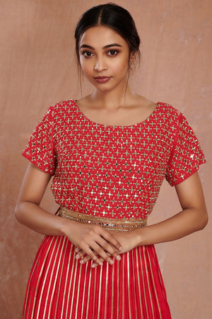 Shop stunning red fit and flare mirror work gown online in USA. Make a fashion statement on festive occasions and weddings with designer suits, Indian dresses, Anarkali suits, palazzo suits, designer gowns, sharara suits from Pure Elegance Indian fashion store in USA.-closeup