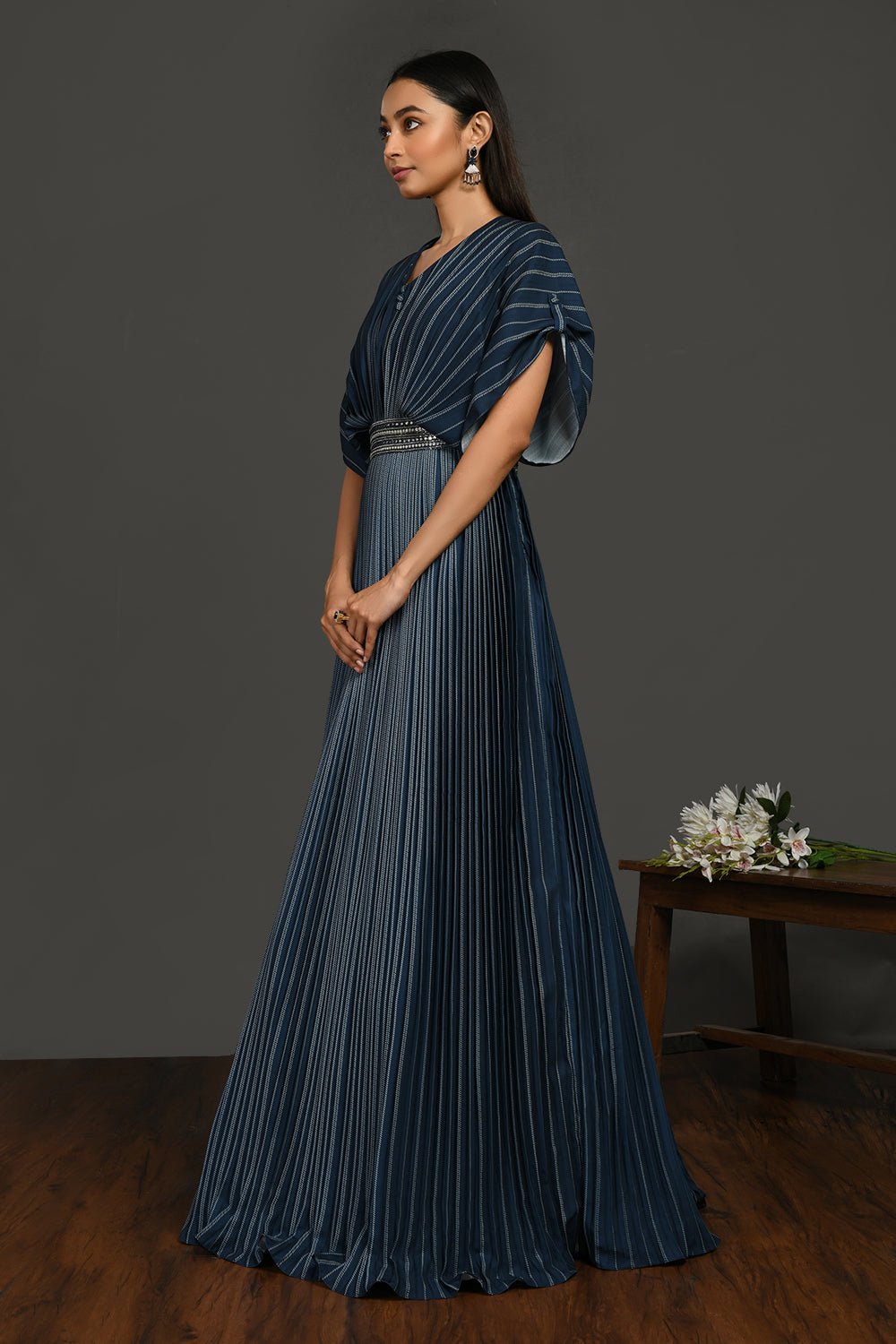 Buy beautiful satin gown pleated gown online in USA with metallic belt. Make a fashion statement on festive occasions and weddings with designer suits, Indian dresses, Anarkali suits, palazzo suits, designer gowns, sharara suits from Pure Elegance Indian fashion store in USA.-side