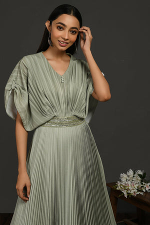 Buy stunning tea green pleated gown online in USA with metallic belt. Make a fashion statement on festive occasions and weddings with designer suits, Indian dresses, Anarkali suits, palazzo suits, designer gowns, sharara suits from Pure Elegance Indian fashion store in USA.-closeup