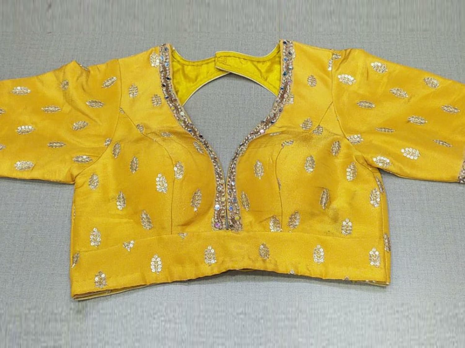 Buy beautiful yellow embroidered readymade saree blouse online in USA. Elevate your Indian ethnic sarees with beautiful readymade sari blouses, embroidered saree blouses, Banarasi saree blouse, designer sari blouses, choli-cut blouses from Pure Elegance Indian fashion store in USA.-full view