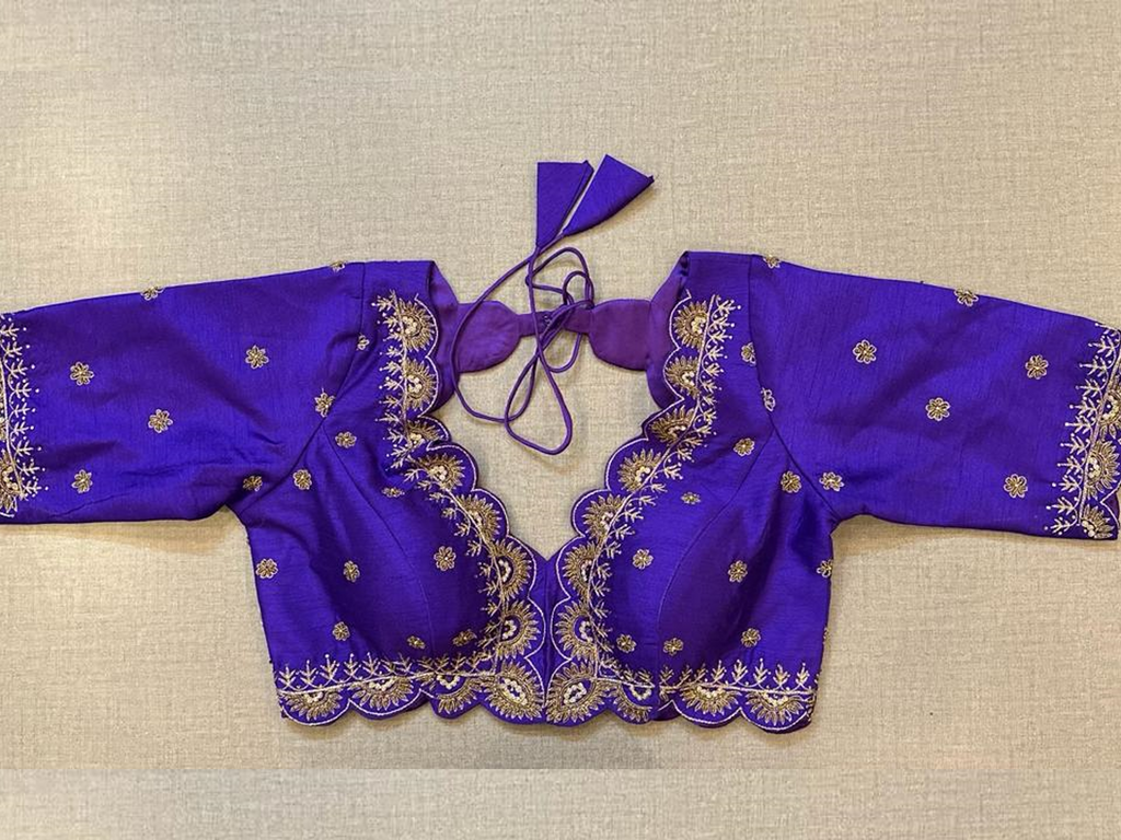 Buy a tailored in a timeless hue and topped with embroidered details, this multicolor blouse is an evergreen addition to your festive wardrobe and party look. It is designed with a U neckline, 3/4th sleeves, and back hook closure. Buy this designer blouse in the USA from Pure Elegance. 