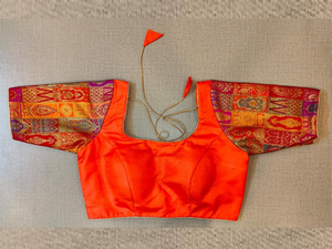 Buy stunning orange saree blouse online in USA with Banarasi sleeves. Elevate your Indian saree style with exquisite readymade sari blouse, embroidered saree blouses, Banarasi saree blouse, designer sari blouse, choli-cut blouses from Pure Elegance Indian clothing store in USA.-full view