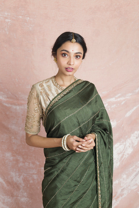 Shop gorgeous mehendi green embroidered mysore silk saree online in USA with cream color embroidered saree blouse. Champion ethnic fashion on weddings and festivals with a stunning collection of designer sarees, handloom sarees with blouse, wedding sarees, from Pure Elegance Indian fashion store in USA.-closeup