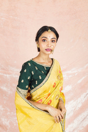 Buy beautiful yellow color embroidered handloom saree online in USA with embroidered green saree blouse. Champion ethnic fashion on weddings and festivals with a stunning collection of Banarasi sarees, handloom sarees with blouse, bridal sarees, from Pure Elegance Indian fashion store in USA.-closeup