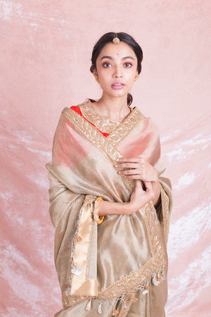 Buy beautiful golden embroidered handloom saree online in USA with red embroidered saree blouse. Champion ethnic fashion on weddings and festivals with a stunning collection of designer sarees, handloom sarees with blouse, bridal sarees, from Pure Elegance Indian fashion store in USA.-closeup