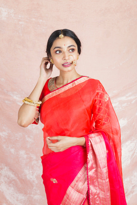 Shop charming red and pink embroidered handloom saree online in USA with red embroidered sari blouse. Champion ethnic fashion on weddings and festivals with a stunning collection of designer sarees, handloom sarees with blouse, bridal sarees, from Pure Elegance Indian fashion store in USA.-closeup