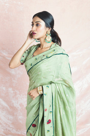 Shop elegant pista green embroidered Banarasi chanderi saree online in USA with sari blouse. Champion ethnic fashion on weddings and festivals with a stunning collection of Banarasi sarees, handloom sarees with blouse, bridal sarees, from Pure Elegance Indian fashion store in USA.-closeup