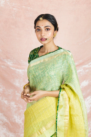 Shop beautiful ombre yellow handloom saree online in USA with green bandhej sari blouse. Champion ethnic fashion on weddings and festivals with a stunning collection of Banarasi sarees, handloom sarees with blouse, bridal sarees, from Pure Elegance Indian fashion store in USA.-closeup