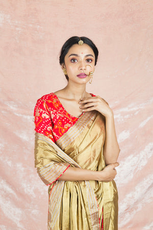 Shop gorgeous golden handloom saree online in USA with red bandhej saree blouse. Champion ethnic fashion on weddings and festivals with a stunning collection of Banarasi sarees, handloom sarees with blouse, bridal sarees, from Pure Elegance Indian fashion store in USA.-closeup