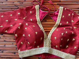 Shop stunning maroon embroidered designer saree blouse online in USA. Elevate your Indian saree style with exquisite readymade saree blouses, embroidered saree blouses, Benarasi saree blouse, fancy saree blouse from Pure Elegance Indian clothing store in USA.-front