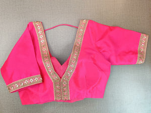Buy stunning neon pink embroidered sari blouse online in USA. Elevate your Indian ethnic saree looks with beautiful readymade saree blouse, embroidered saree blouses, Banarasi saree blouse, designer sari blouses from Pure Elegance Indian fashion store in USA.-back