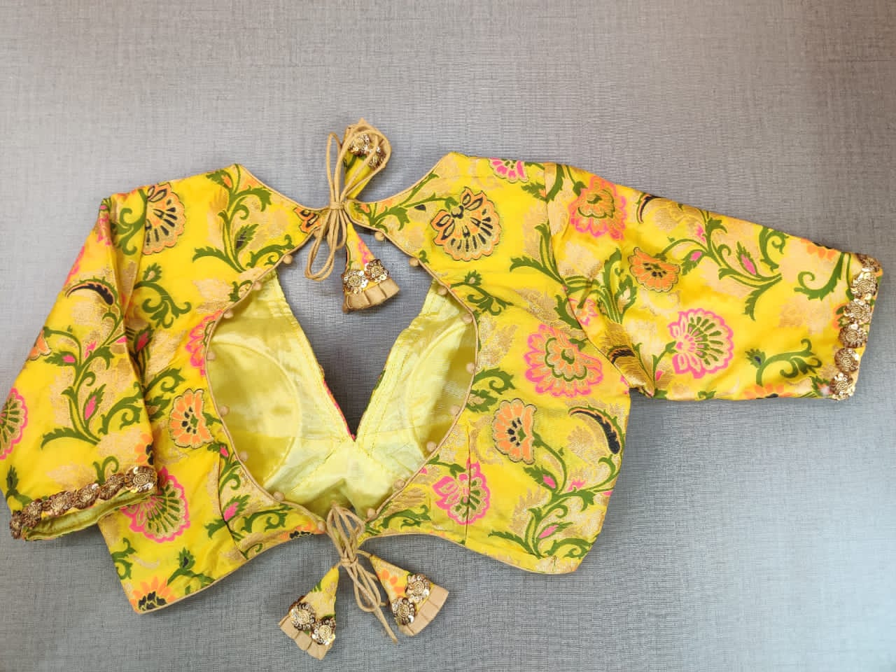 Buy beautiful yellow embroidered neckline Banarasi sari blouse online in USA. Elevate your Indian ethnic saree looks with beautiful readymade saree blouse, embroidered sari blouses, Banarasi saree blouse, designer sari from Pure Elegance Indian fashion store in USA.-back