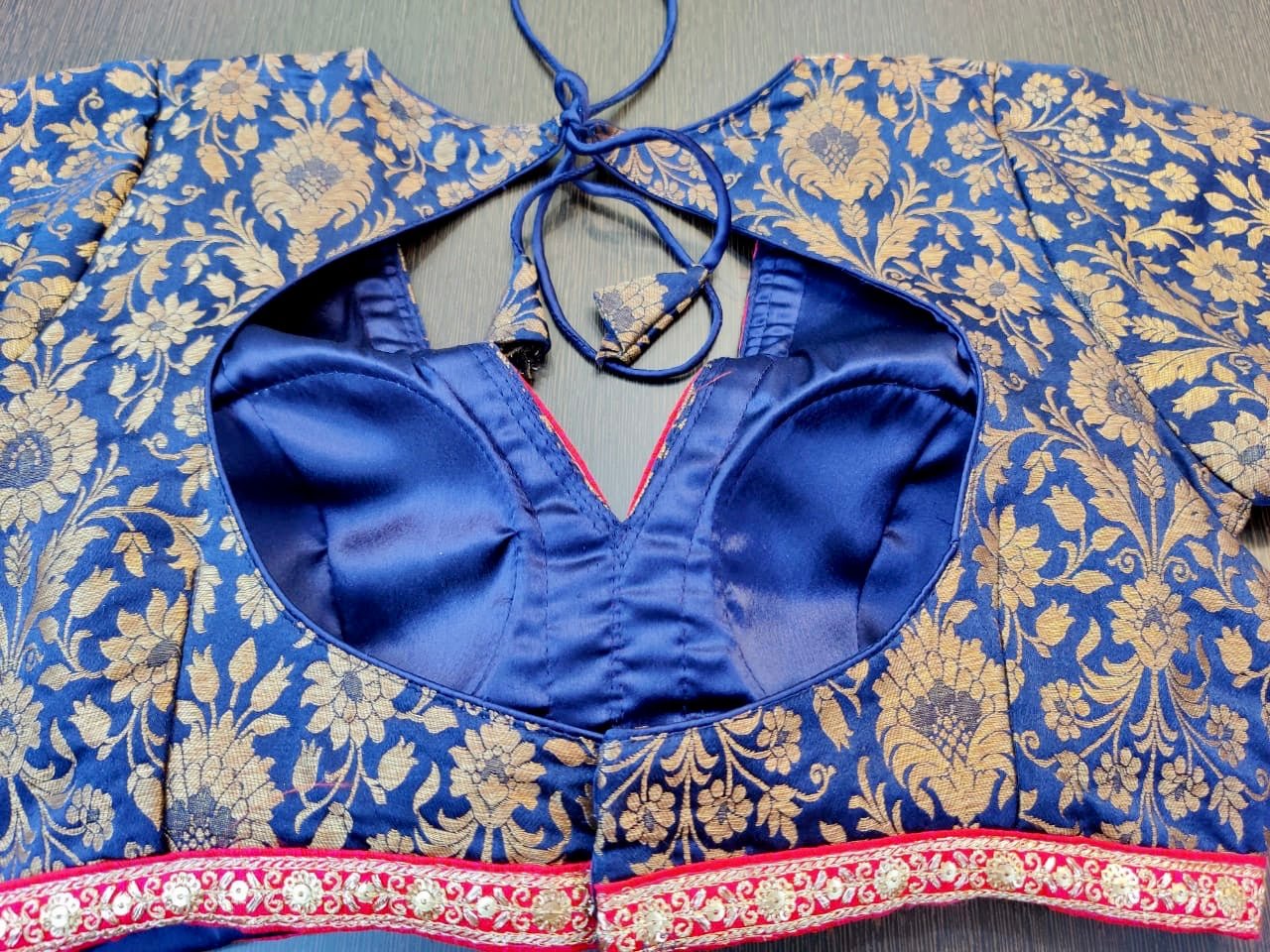 Buy blue designer sari blouse online in USA with pink embroidered lace. Elevate your ethnic saree style with a tasteful collection of designer saree blouses, embroidered saree blouses, Banarasi saree blouse, silk sari blouse from Pure Elegance Indian clothing store in USA.-back