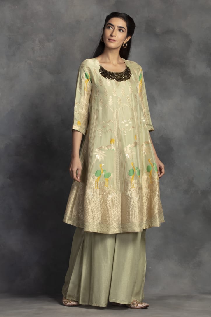 Buy gorgeous pista green Banarasi silk suit online in USA with palazzo. Make a fashion statement on festive occasions with palazzo suits, sharara suits, partywear dresses, salwar suits from Pure Elegance Indian fashion store in USA.-full view