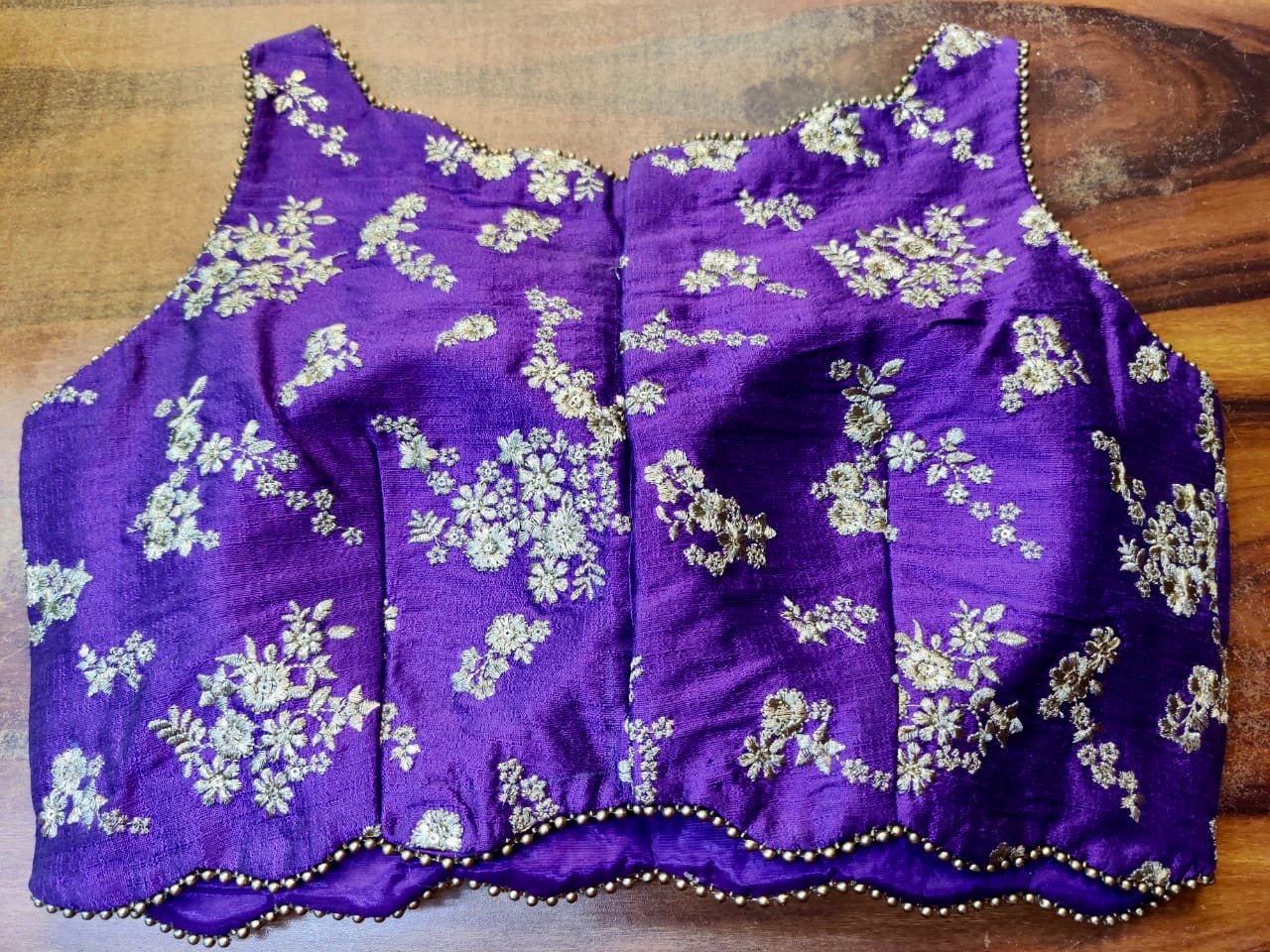 Buy stunning purple embroidered sleeveless saree blouse online in USA. Elevate your ethnic saree style with a tasteful collection of designer saree blouses, embroidered sari blouses, Banarasi blouses, silk saree blouses from Pure Elegance Indian clothing store in USA.-back