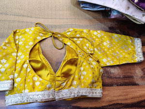 Shop gorgeous yellow embroidered georgette saree blouse online in USA. Elevate your ethnic saree style with a tasteful collection of designer saree blouses, fancy sari blouses, embroidered saree blouses from Pure Elegance Indian clothing store in USA.-back