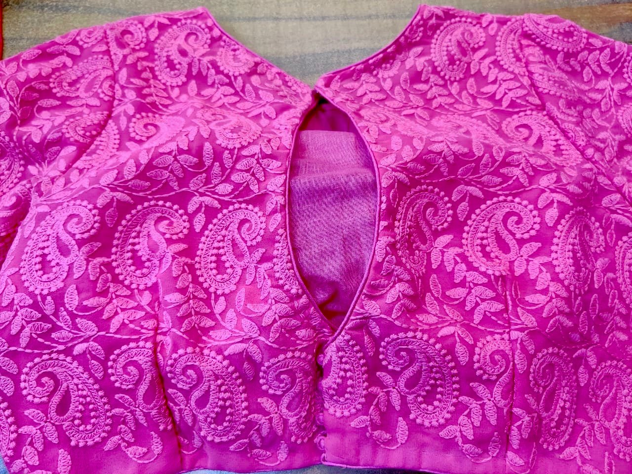 Shop pink Lucknowi embroidery designer saree blouse online in USA. Elevate your ethnic saree style with a tasteful collection of designer saree blouses, embroidered sari blouses, Banarasi blouses, silk saree blouses from Pure Elegance Indian clothing store in USA.-back