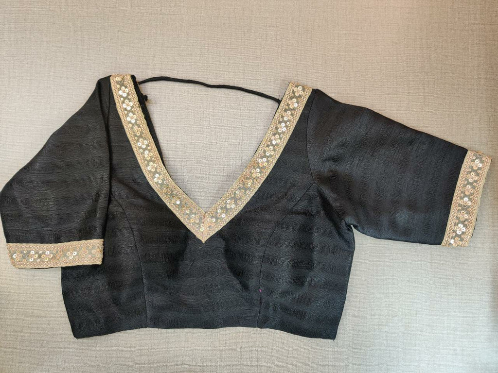 Buy beautiful black embroidered sari blouse online in USA with puff sleeves. Elevate your Indian ethnic saree looks with beautiful readymade saree blouse, embroidered saree blouses, Banarasi saree blouse, designer sari blouses from Pure Elegance Indian fashion store in USA.-full view