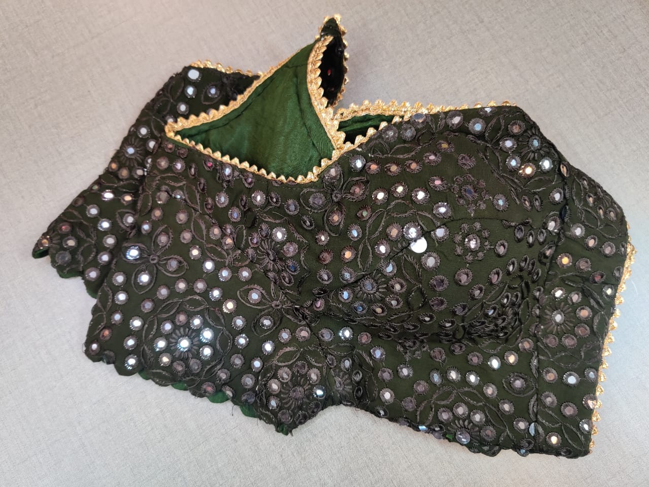 Shop gorgeous green mirror work designer saree blouse online in USA. Elevate your Indian ethnic saree looks with beautiful readymade saree blouse, embroidered saree blouses, Banarasi saree blouse, designer sari blouses from Pure Elegance Indian fashion store in USA.-sleeves
