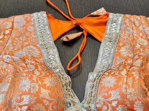 Buy stunning orange designer saree blouse online in USA with embroidered lace. Elevate your ethnic saree style with a tasteful collection of designer saree blouses, embroidered saree blouses, Banarasi saree blouse, silk sari blouse from Pure Elegance Indian clothing store in USA.-neck