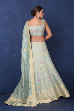 Shop beautiful mint green Banarasi embroidered lehenga online in USA with dupatta, Be the center of attraction on festive occasions in beautiful designer suits, dresses, lehengas, designer gowns, from Pure Elegance Indian fashion store in USA.-back