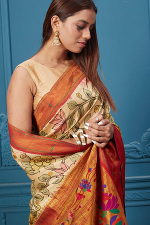 Shop cream Kalamkari Paithani sari online in USA with red zari border. Look your best on festive occasions in latest designer sarees, pure silk saris, Kanchipuram silk sarees, handwoven sarees, tussar silk sarees, embroidered saris from Pure Elegance Indian clothing store in USA.-closeup