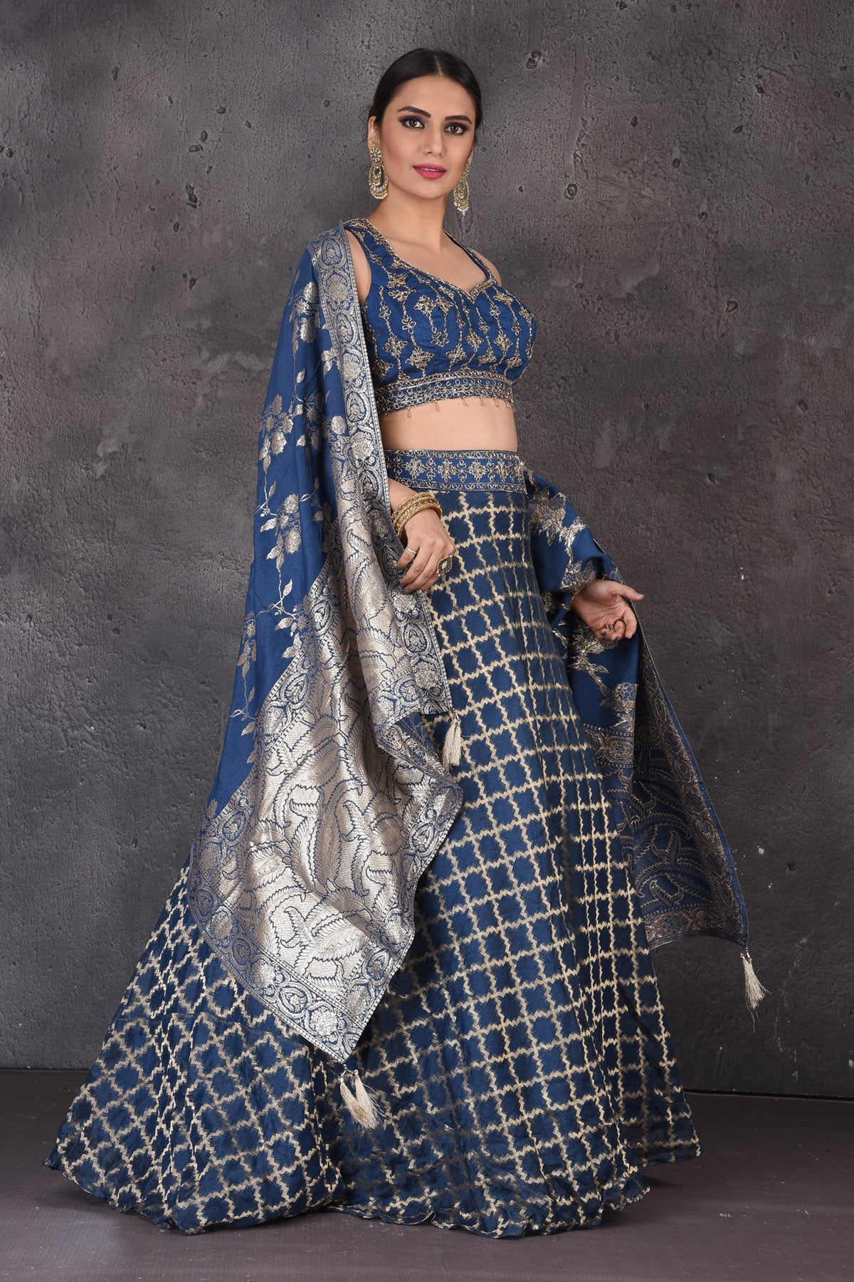 Shop beautiful blue embroidered designer lehenga online in USA with dupatta. Look elegant at weddings and festive occasions in exclusive designer suits, designer gowns, Anarkali suits, sharara suits, wedding gowns, palazzo suits, designer lehenga from Pure Elegance Indian clothing store in USA.-full view