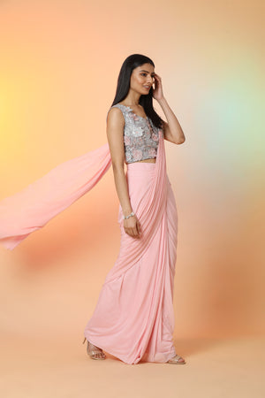 Buy stunning powder pink embroidered crepe ready-to-wear sari online in USA with blouse. Radiate glamor on special occasions in exquisite designer sarees, embroidered sarees, partywear saris, Bollywood sarees, fancy sarees from from Pure Elegance Indian saree store in USA.-side