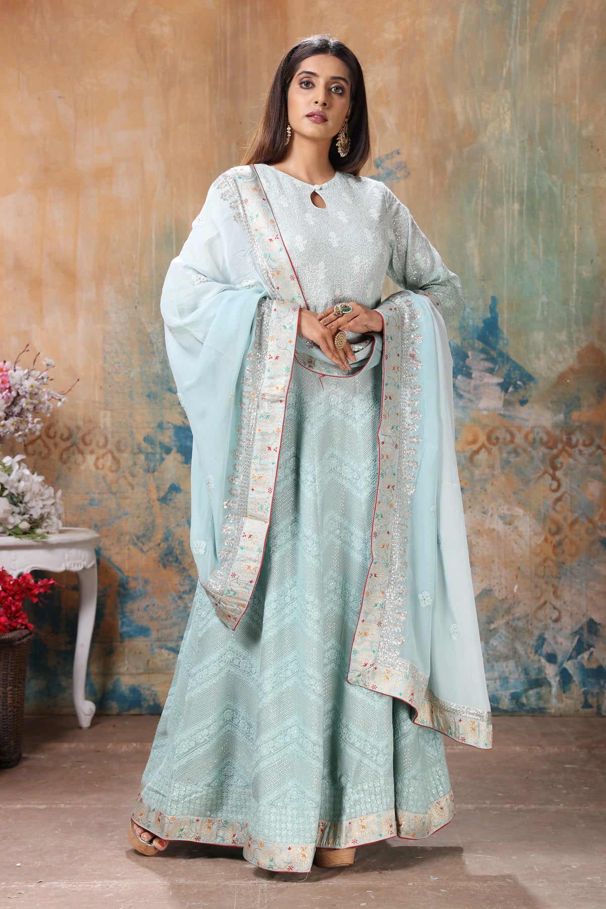 Buy Daisy white anarkali suit in georgette with lucknowi thread embroidered  kalis and mughal motifs on the border.