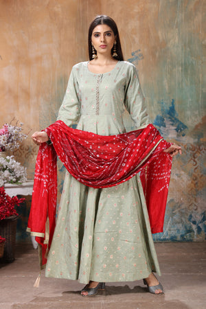 Buy stunning light grey embroidered Anarkali suit online in USA with red bandhej dupatta. Flaunt Indian style at parties and weddings in beautiful designer dresses, salwar suits, Anarkali suits, gowns, palazzo suits from Pure Elegance Indian fashion store in USA.-front