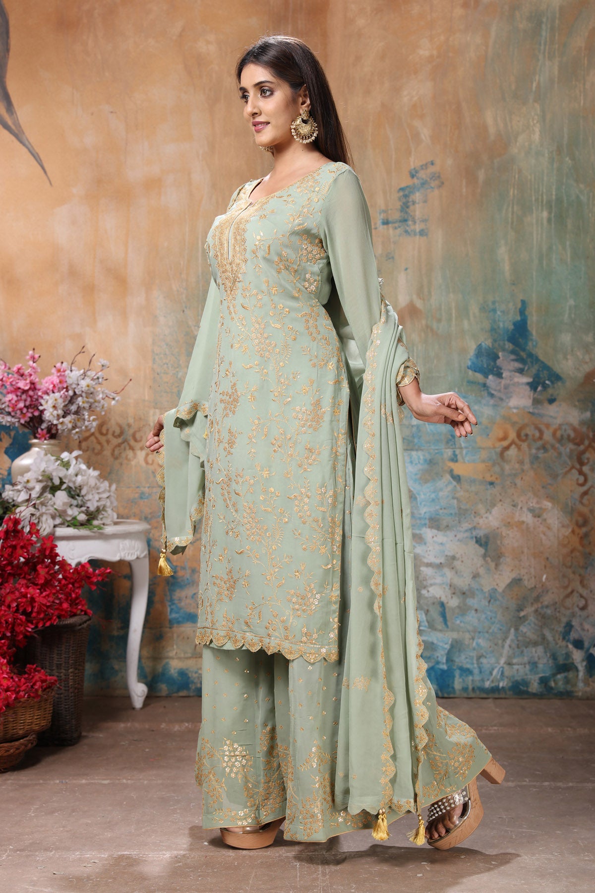 Shop beautiful mint green embroidered sharara suit online in USA with dupatta. Flaunt Indian style at parties and weddings in beautiful designer dresses, salwar suits, Anarkali suits, gowns, palazzo suits from Pure Elegance Indian fashion store in USA.-side