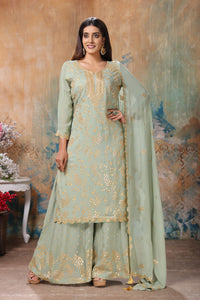 Shop beautiful mint green embroidered sharara suit online in USA with dupatta. Flaunt Indian style at parties and weddings in beautiful designer dresses, salwar suits, Anarkali suits, gowns, palazzo suits from Pure Elegance Indian fashion store in USA.-full view