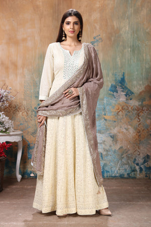 Buy gorgeous light yellow embroidered Anarkali suit online in USA with beige dupatta. Flaunt Indian style at parties and weddings in beautiful designer dresses, salwar suits, Anarkali suits, gowns, palazzo suits from Pure Elegance Indian fashion store in USA.-front