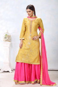 Buy gorgeous yellow embroidered sharara suit online in USA with pink dupatta. Flaunt Indian style at parties and weddings in beautiful designer dresses, salwar suits, Anarkali suits, gowns, palazzo suits from Pure Elegance Indian fashion store in USA.-full view