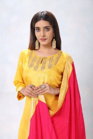 Shop beautiful yellow and pink embroidered crepe palazzo suit online in USA with dupatta. Flaunt Indian style at parties and weddings in beautiful designer dresses, salwar suits, Anarkali suits, gowns, palazzo suits from Pure Elegance Indian fashion store in USA.-closeup
