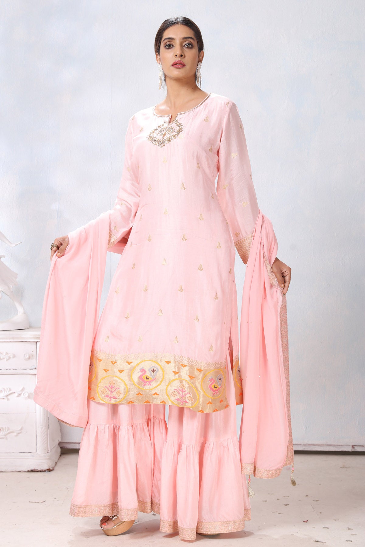 Shop stunning powder pink embroidered sharara suit online in USA with dupatta. Flaunt Indian style at parties and weddings in beautiful designer dresses, salwar suits, Anarkali suits, gowns, palazzo suits from Pure Elegance Indian fashion store in USA.-side
