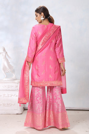 Shop stunning pink embroidered sharara suit online in USA with dupatta. Flaunt Indian style at parties and weddings in beautiful designer dresses, salwar suits, Anarkali suits, gowns, palazzo suits from Pure Elegance Indian fashion store in USA.-back