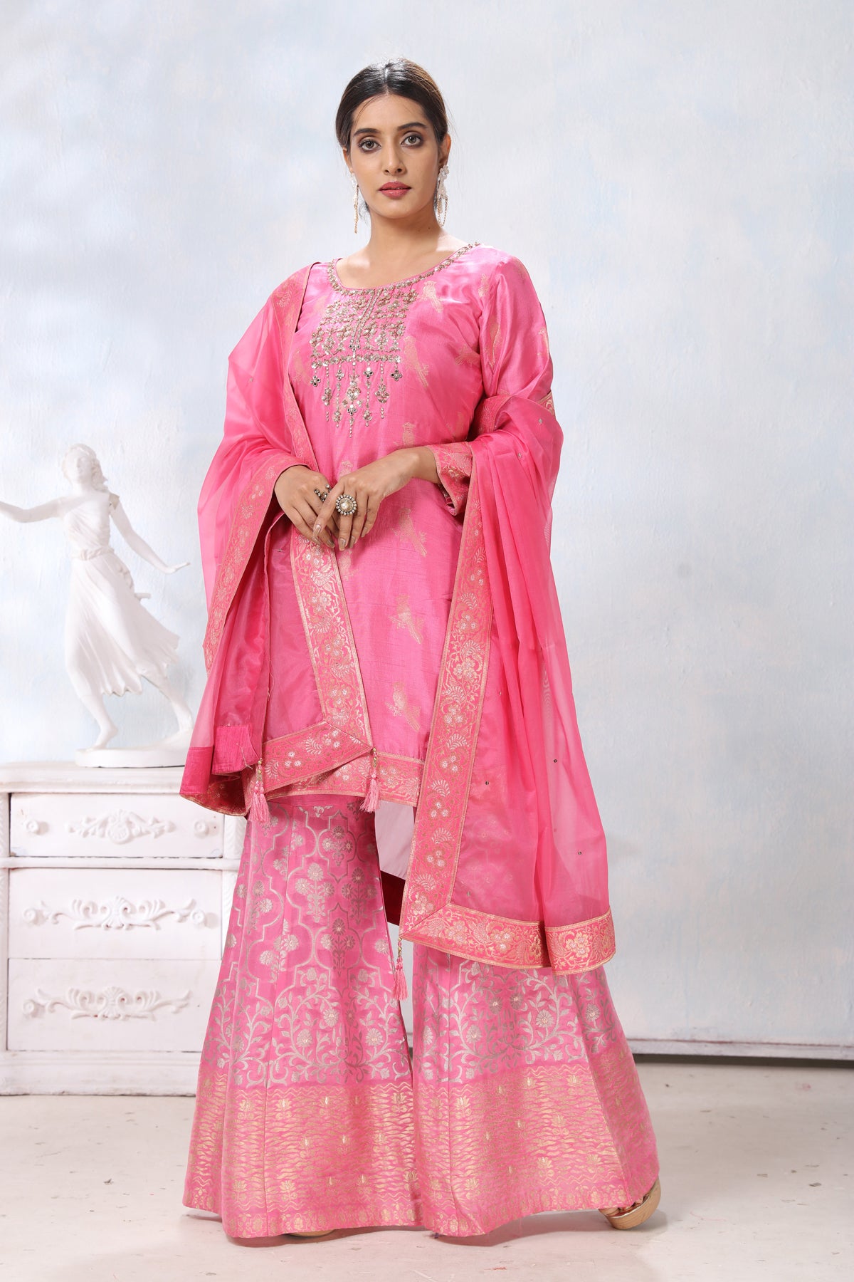 Shop stunning pink embroidered sharara suit online in USA with dupatta. Flaunt Indian style at parties and weddings in beautiful designer dresses, salwar suits, Anarkali suits, gowns, palazzo suits from Pure Elegance Indian fashion store in USA.-full view