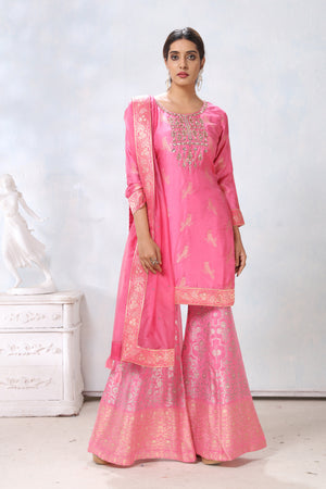 Shop stunning pink embroidered sharara suit online in USA with dupatta. Flaunt Indian style at parties and weddings in beautiful designer dresses, salwar suits, Anarkali suits, gowns, palazzo suits from Pure Elegance Indian fashion store in USA.-sharara
