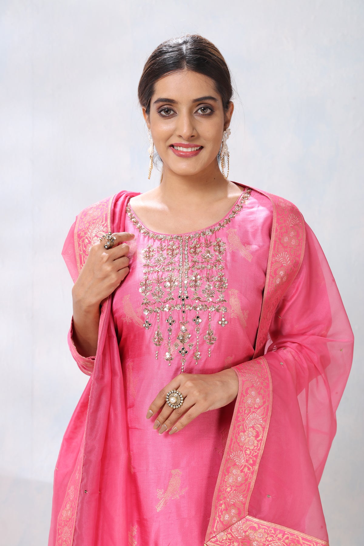 Shop stunning pink embroidered sharara suit online in USA with dupatta. Flaunt Indian style at parties and weddings in beautiful designer dresses, salwar suits, Anarkali suits, gowns, palazzo suits from Pure Elegance Indian fashion store in USA.-closeup