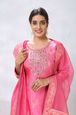 Shop stunning pink embroidered sharara suit online in USA with dupatta. Flaunt Indian style at parties and weddings in beautiful designer dresses, salwar suits, Anarkali suits, gowns, palazzo suits from Pure Elegance Indian fashion store in USA.-closeup