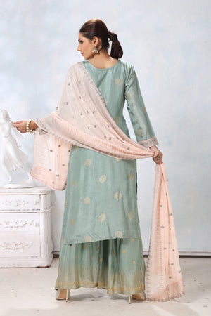 Buy stunning pastel green embroidered palazzo suit online in USA with cream dupatta. Flaunt Indian style at parties and weddings in beautiful designer dresses, salwar suits, Anarkali suits, gowns, palazzo suits from Pure Elegance Indian fashion store in USA.-back