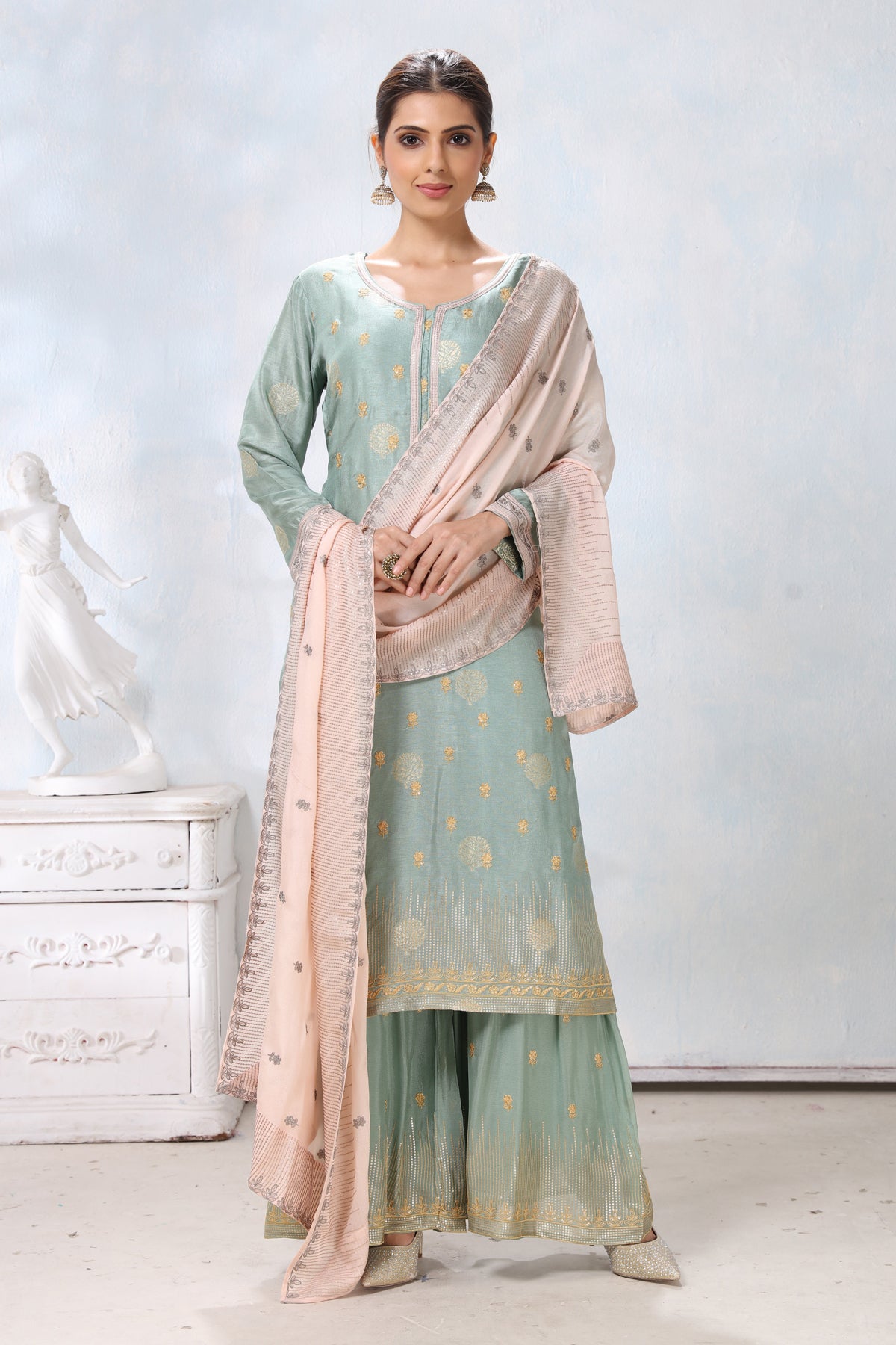 Buy stunning pastel green embroidered palazzo suit online in USA with cream dupatta. Flaunt Indian style at parties and weddings in beautiful designer dresses, salwar suits, Anarkali suits, gowns, palazzo suits from Pure Elegance Indian fashion store in USA.-front