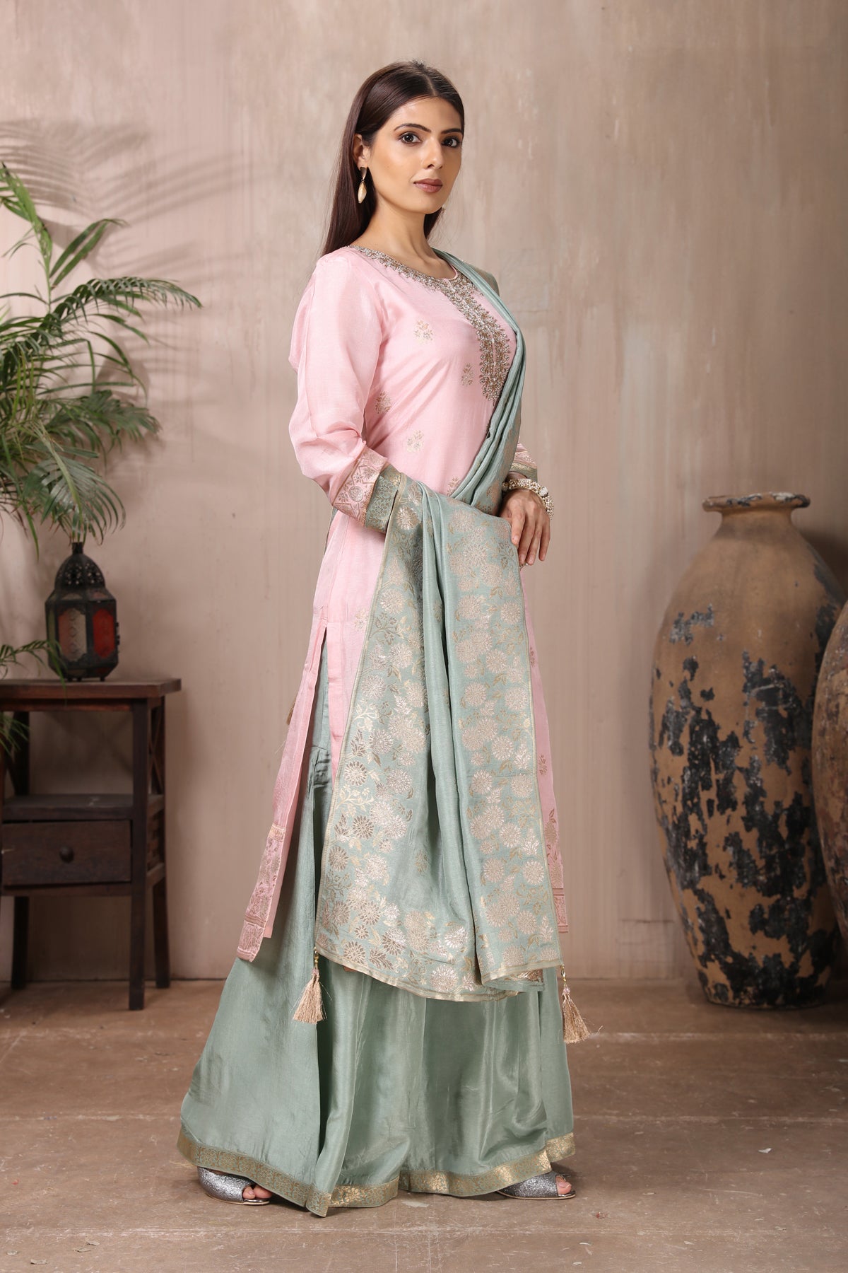 Buy gorgeous powder pink embroidered sharara suit online in USA with grey dupatta. Flaunt Indian style at parties and weddings in beautiful designer dresses, salwar suits, Anarkali suits, gowns, palazzo suits from Pure Elegance Indian fashion store in USA.-right