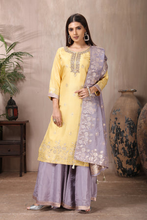 Shop stunning yellow and grey embroidered silk suit online in USA with dupatta. Flaunt Indian style at parties and weddings in beautiful designer dresses, salwar suits, Anarkali suits, gowns, palazzo suits from Pure Elegance Indian fashion store in USA.-front
