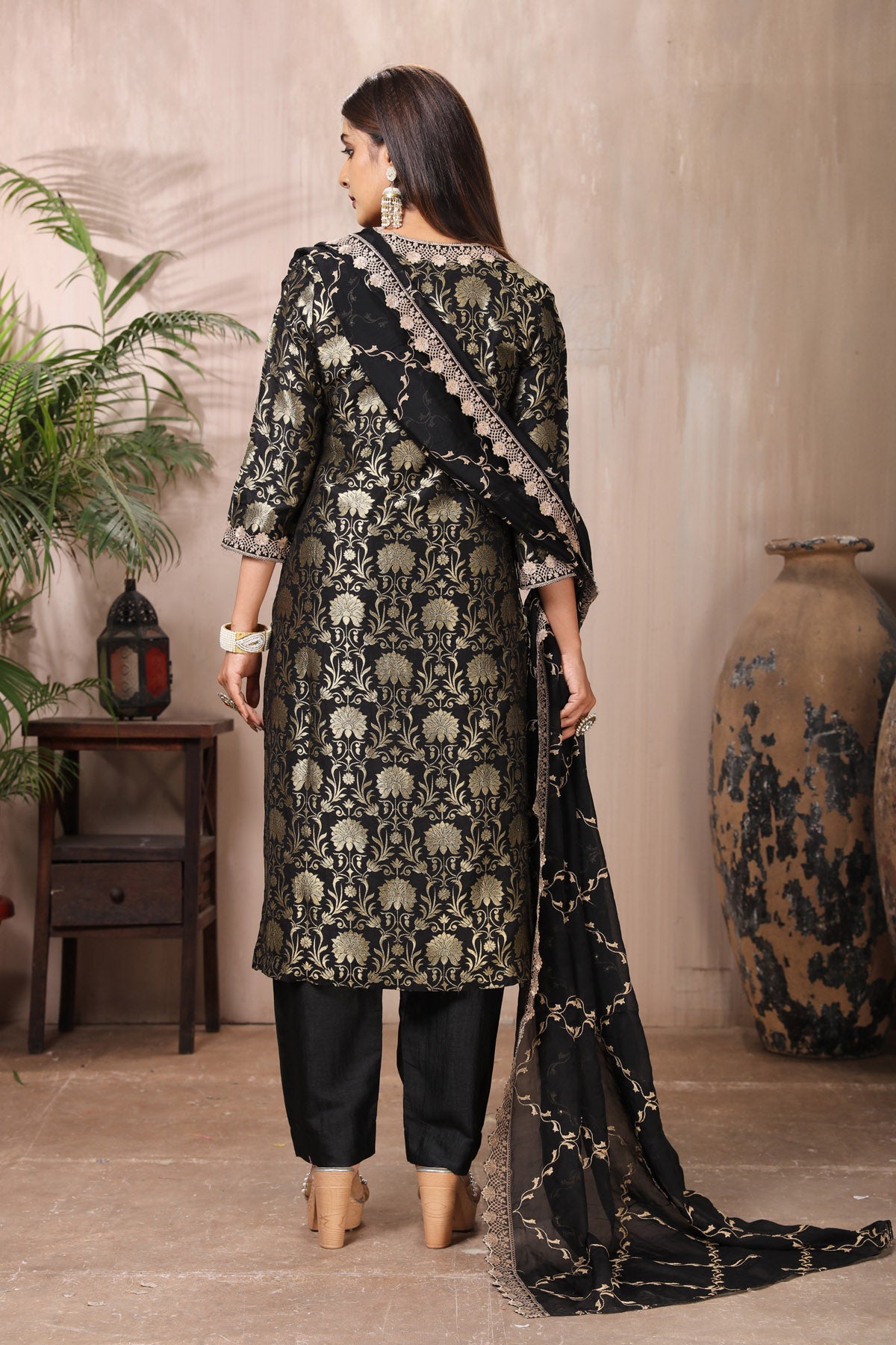 Shop stunning black Banarasi suit online in USA with pants and dupatta. Flaunt Indian style at parties and weddings in beautiful designer dresses, salwar suits, Anarkali suits, gowns, palazzo suits from Pure Elegance Indian fashion store in USA.-back