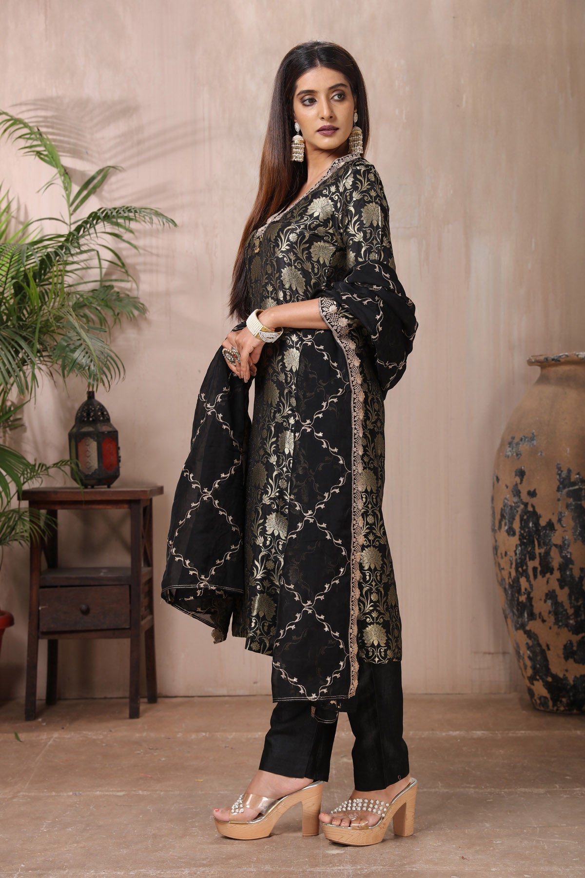 Shop stunning black Banarasi suit online in USA with pants and dupatta. Flaunt Indian style at parties and weddings in beautiful designer dresses, salwar suits, Anarkali suits, gowns, palazzo suits from Pure Elegance Indian fashion store in USA.-side