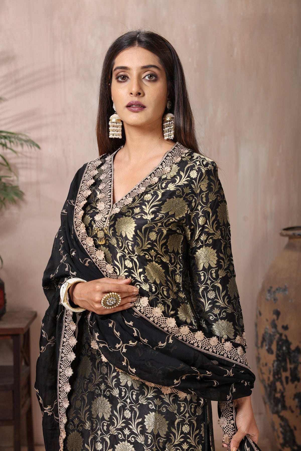 Shop stunning black Banarasi suit online in USA with pants and dupatta. Flaunt Indian style at parties and weddings in beautiful designer dresses, salwar suits, Anarkali suits, gowns, palazzo suits from Pure Elegance Indian fashion store in USA.-closeup
